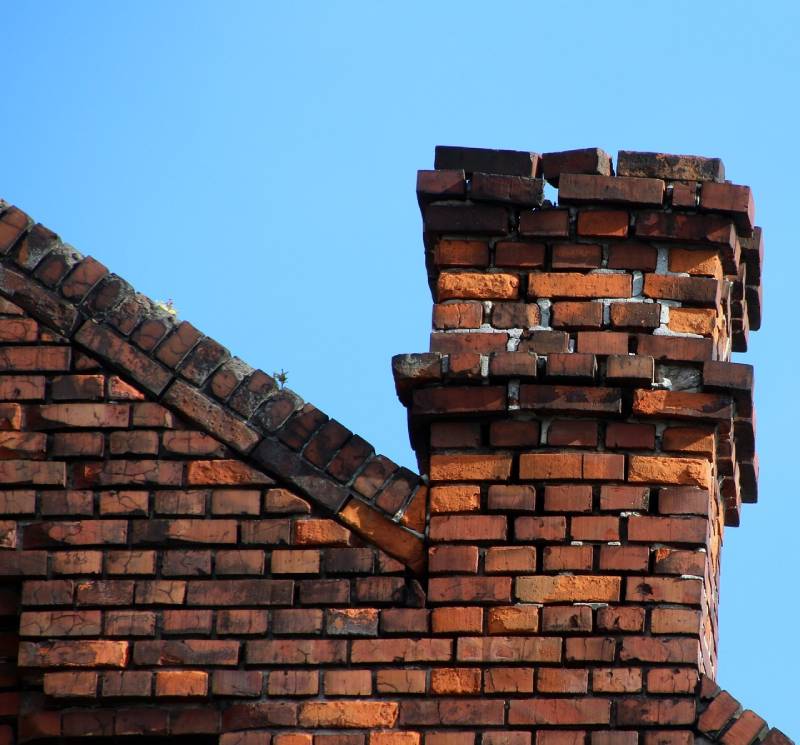 Signs Your Forest Hill Home Needs a Chimney Inspection Blog Article - Damaged chimney on an Forest Hill home showing cracks and missing mortar